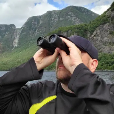 Photo of Mick Eason looking through binnoculars